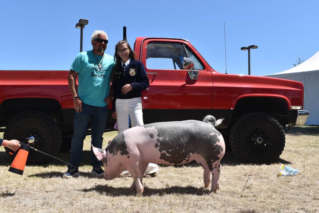Guy Fieri and a pig